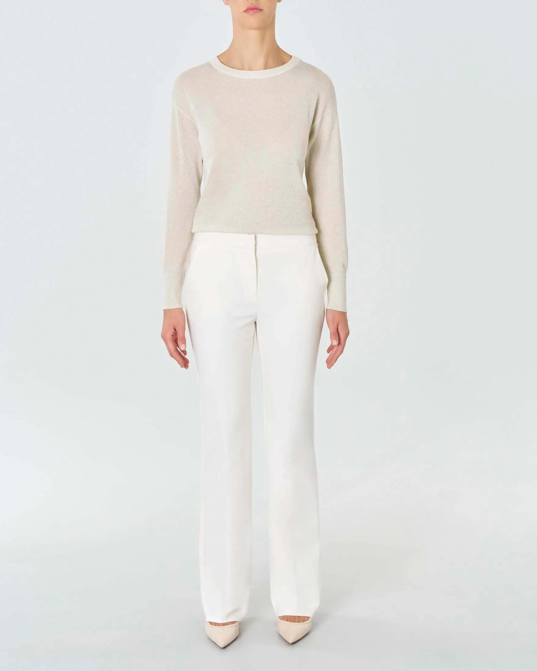 Pantaloni color panna in misto cotone stretch dalla linea flare al fondo